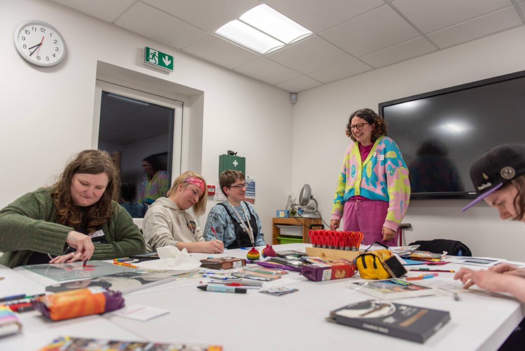People doing a creative workshop around a table